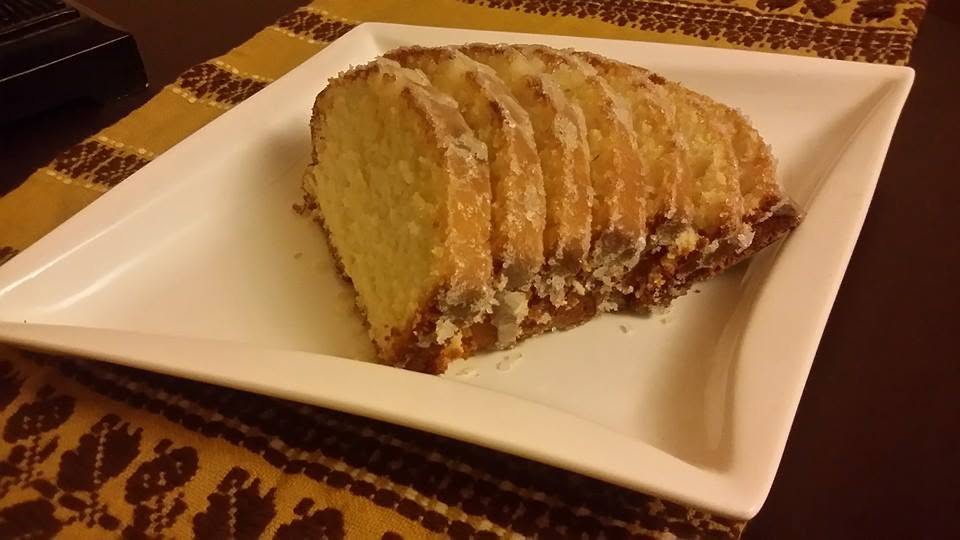 A slice of homemade lemon butter loaf cake.