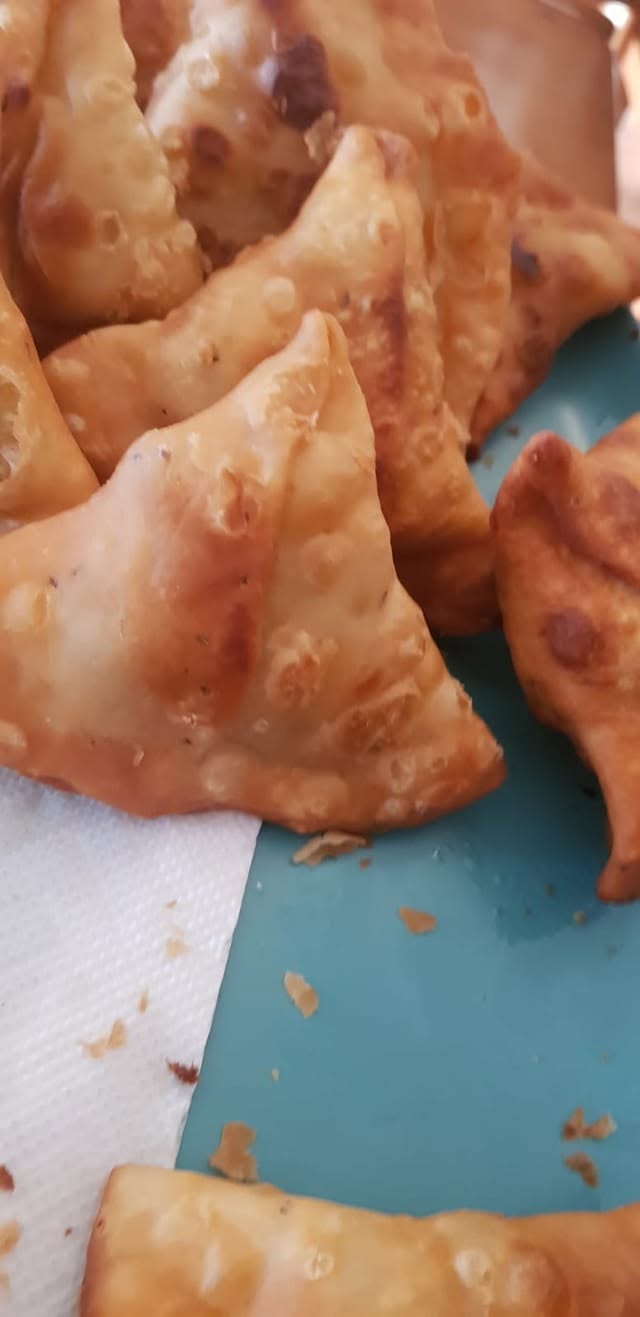 Golden homemade potato samosas.